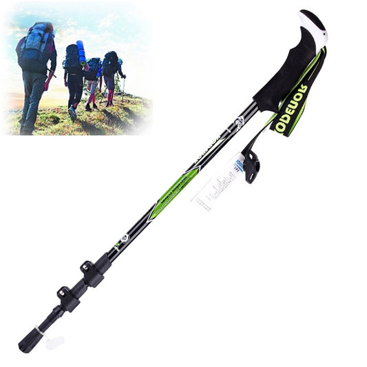 Foldable carbon fiber trekking pole with black shaft, green logo strap, and wrist loop