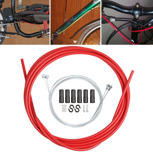 Red bicycle brake cable tube set with coiled housing, inner wire, ferrules, and caps