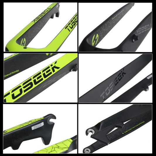 Close-up of full-carbon mountain bike front fork with green-and-black fork legs