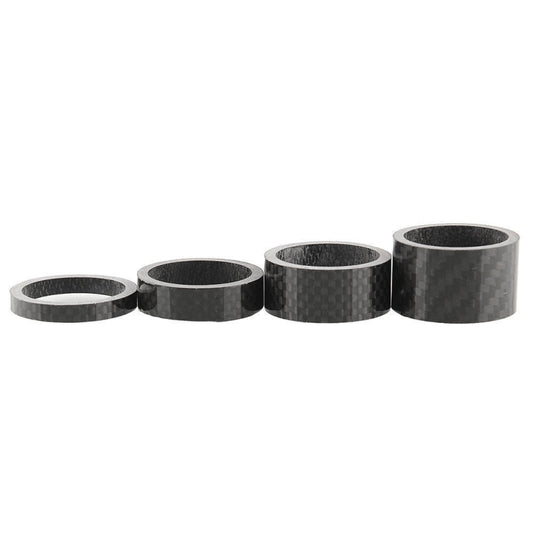 Five-seat view of black carbon fiber spacer rings for bike headset, short cylindrical pieces