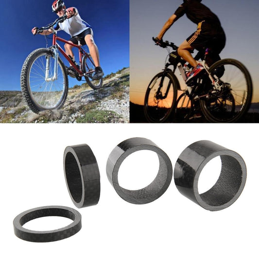 Set of black carbon fiber bike headset spacer rings, cylindrical with textured weave