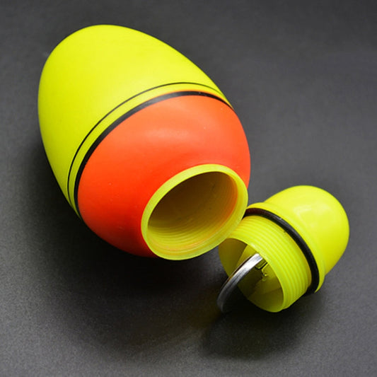 Luminous fishing float bobber, red-and-yellow body with green cap, tubular end