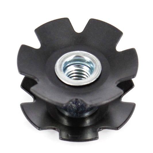 Black star-shaped bike headset nut with metal threaded insert