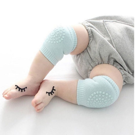 Anti-slip knee and elbow guards in light blue, round textured grip pads