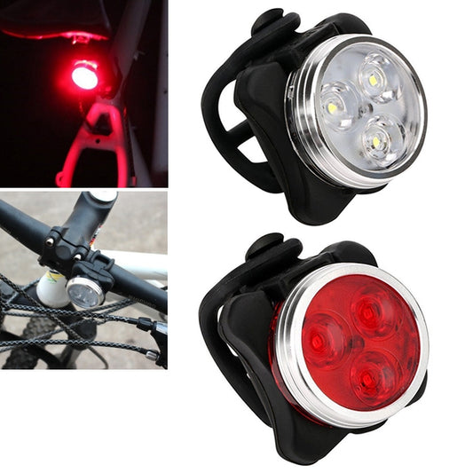 Black bicycle front light with clear lens and circular LED cluster
