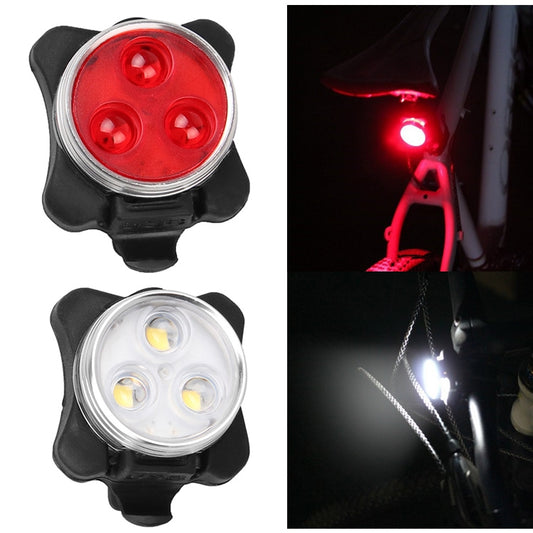 Red bicycle taillight with circular lens and black mounting bracket.