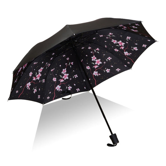 Open black umbrella with pink cherry blossom floral pattern and black frame