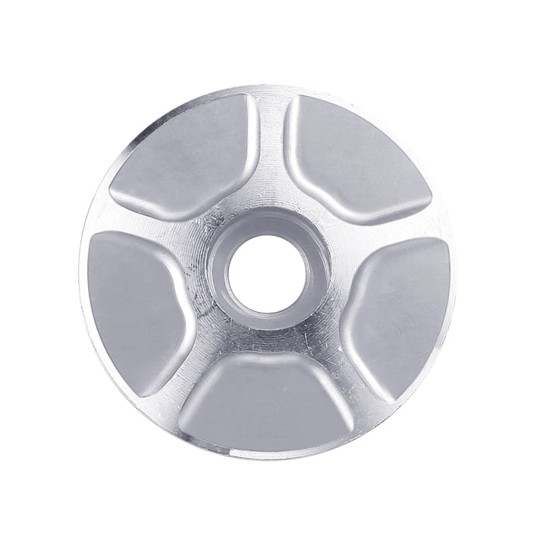 CNC aluminum bike headset cap, silver face with light gray inset pads and center hole