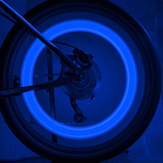 Blue LED bicycle wheel spoke lights on a glowing wheel rim, two light units