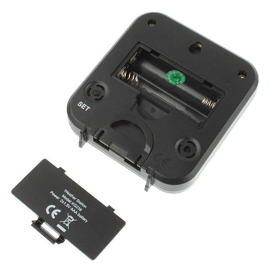 Black digital thermometer back with battery compartment and SET button