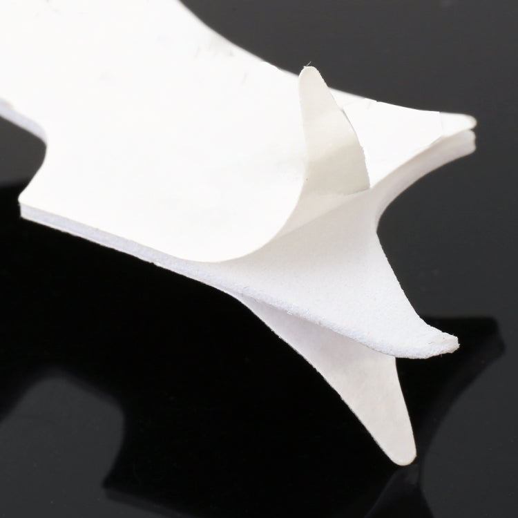 Close-up of silver 3D bat car sticker with raised wing edges