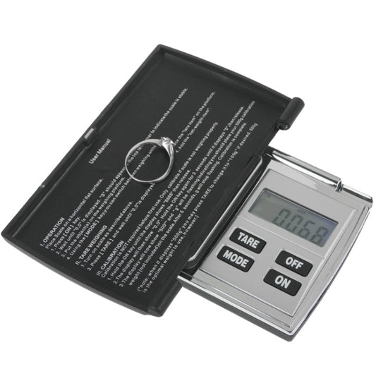 Flip-open digital scale with open lid, circular platform, and LCD weight readout.