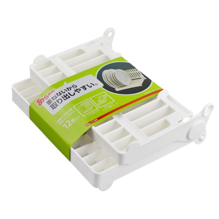 White foldable dish rack displayed on a retail insert with accessory compartments