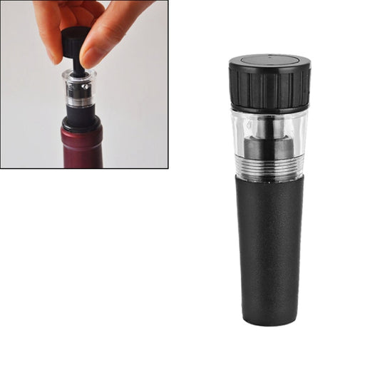 Black vacuum wine bottle stopper with clear insert and silver band, held by hand