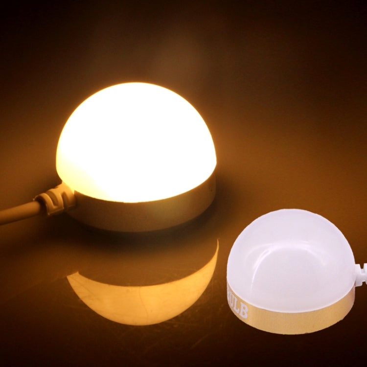 USB LED mini bulb light with frosted dome, glowing, and USB power cable