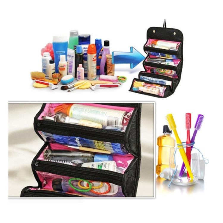 Black hanging cosmetic organizer bag with open compartments holding toiletries
