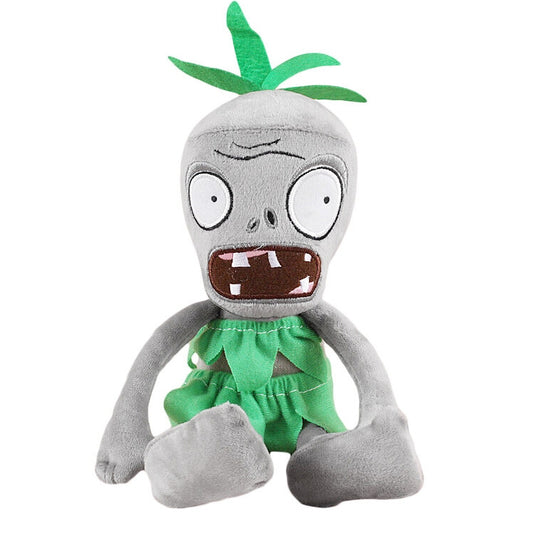 Plush zombie doll in green ragged dress with leaf-like head tuft and big eyes