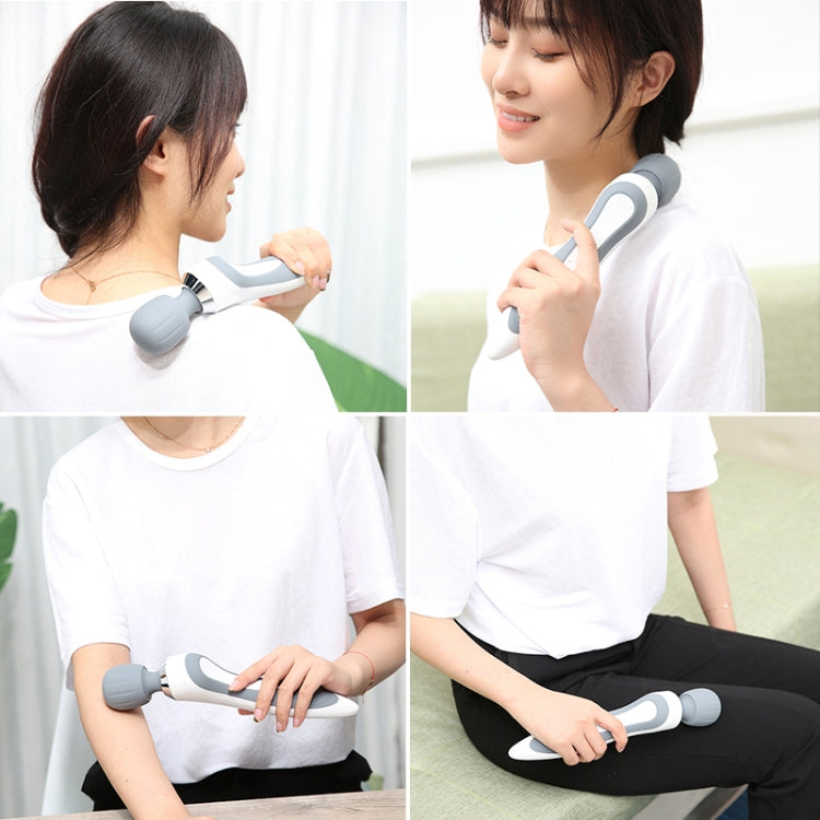 Portable electric massage stick with gray grip and round massage head, shown in use
