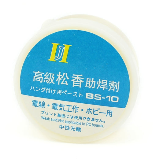 Round flux jar top view with blue II BS-10 label on a cream base