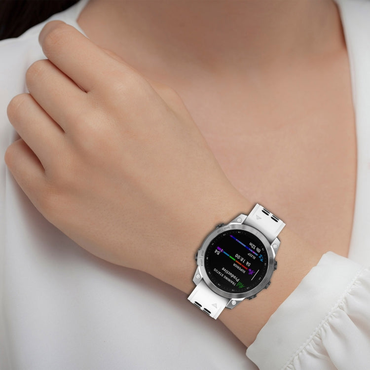 White and black silicone watch band with perforated holes on wrist