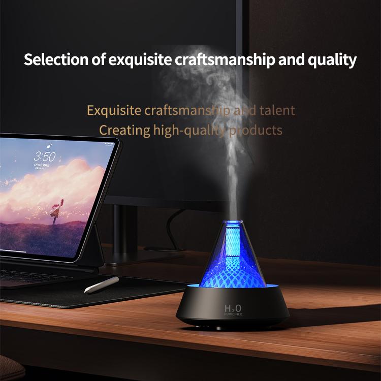Ultrasonic humidifier diffuser with glowing blue light on dark base