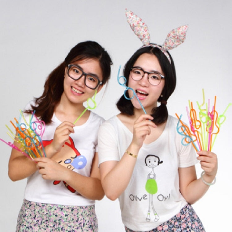 Curved plastic party straws in bright assorted colors held by two people, front view