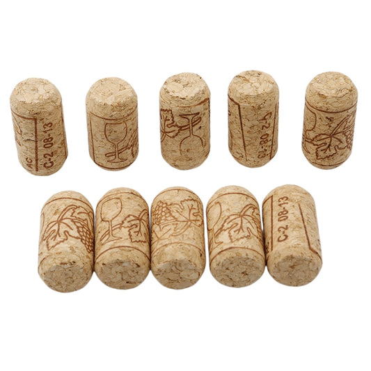 Assorted synthetic cork wine stoppers with brown etched designs, tan cylinders