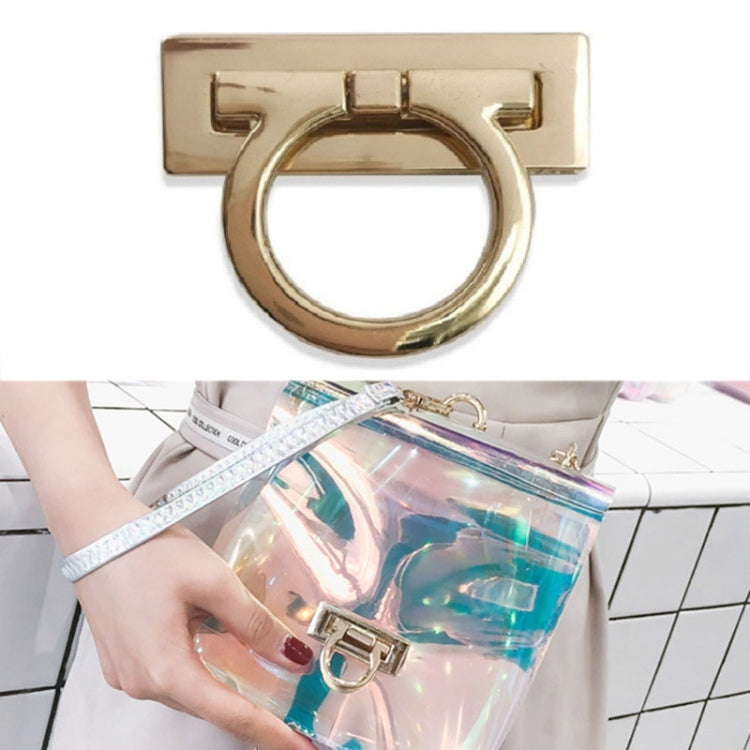 Gold-tone bull-nose ring lock on clear handbag strap with bag hardware