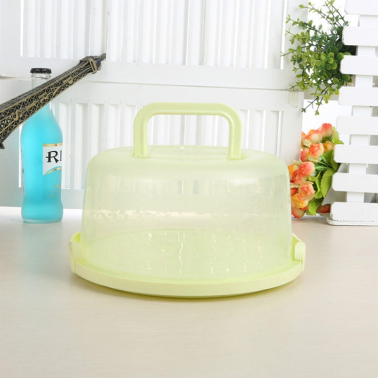 Light green round-handle plastic storage/cake box with domed lid and base tray.