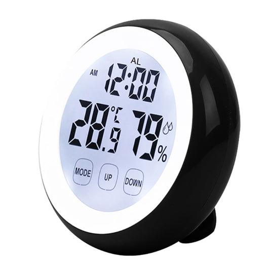 Black indoor electronic thermometer with white face and digits for time, temperature, humidity.