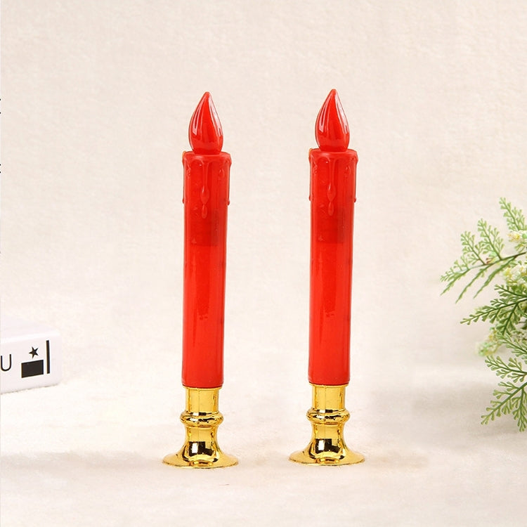 Two red LED pillar candles with clear wicks and gold bases.