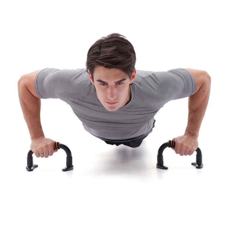 H-shaped push-up stand positioned on suction cup bases for hands during push-ups