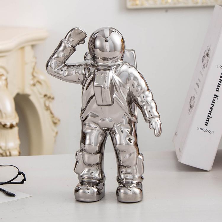 Silver astronaut ceramic vase figurine with raised salute hand for dried flowers