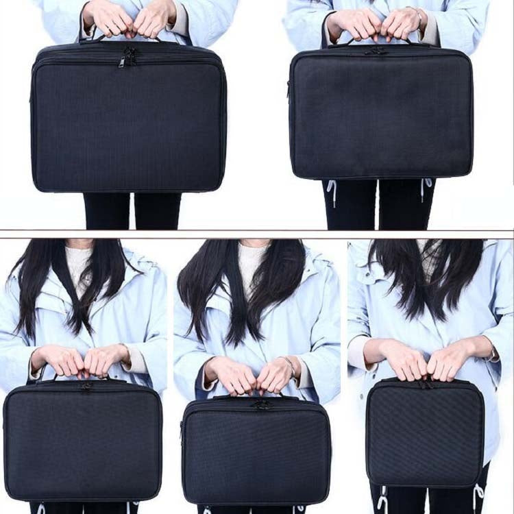 Black rectangular makeup case with top handle, shown being carried