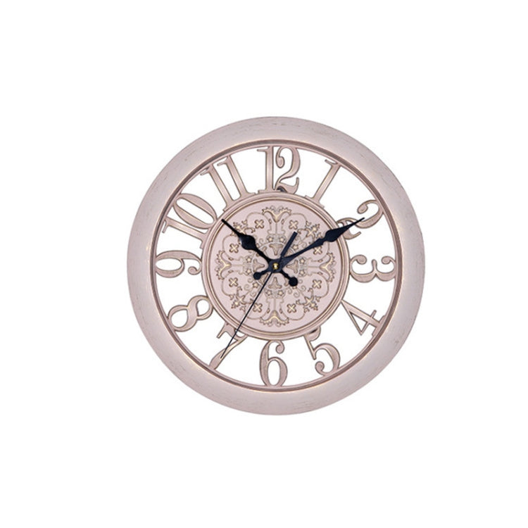 Round antique pink quartz wall clock with ornate roman numerals and light gear dial