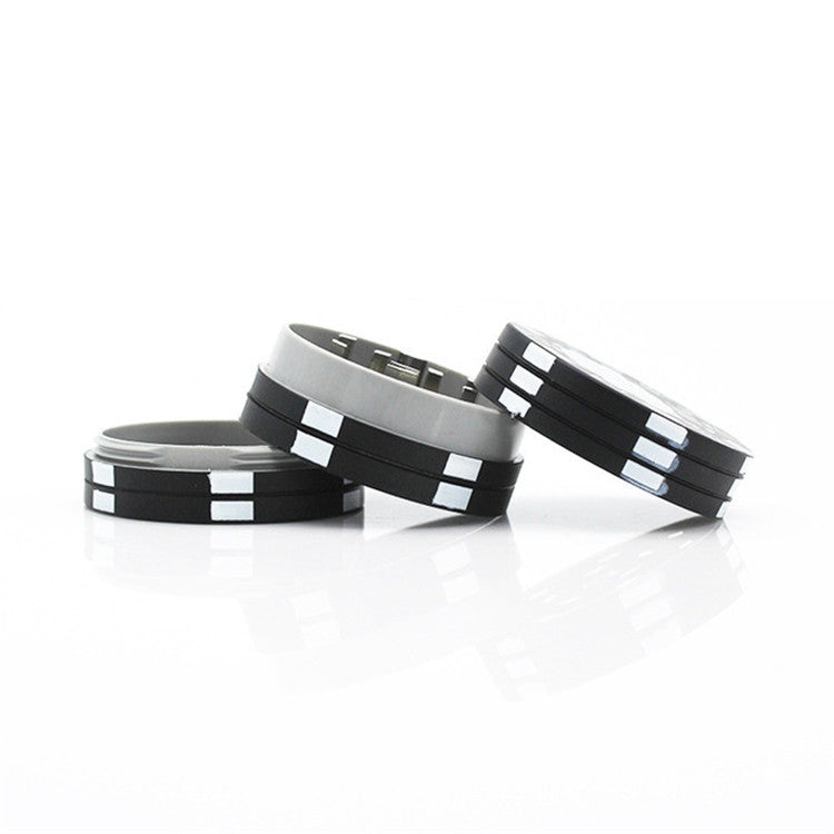 3-layer zinc alloy cigarette grinder with poker-chip design, black and silver discs