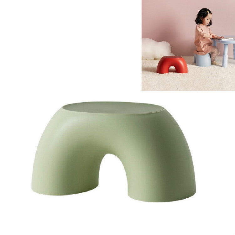 Green round kids stool with front cutout and flat top.