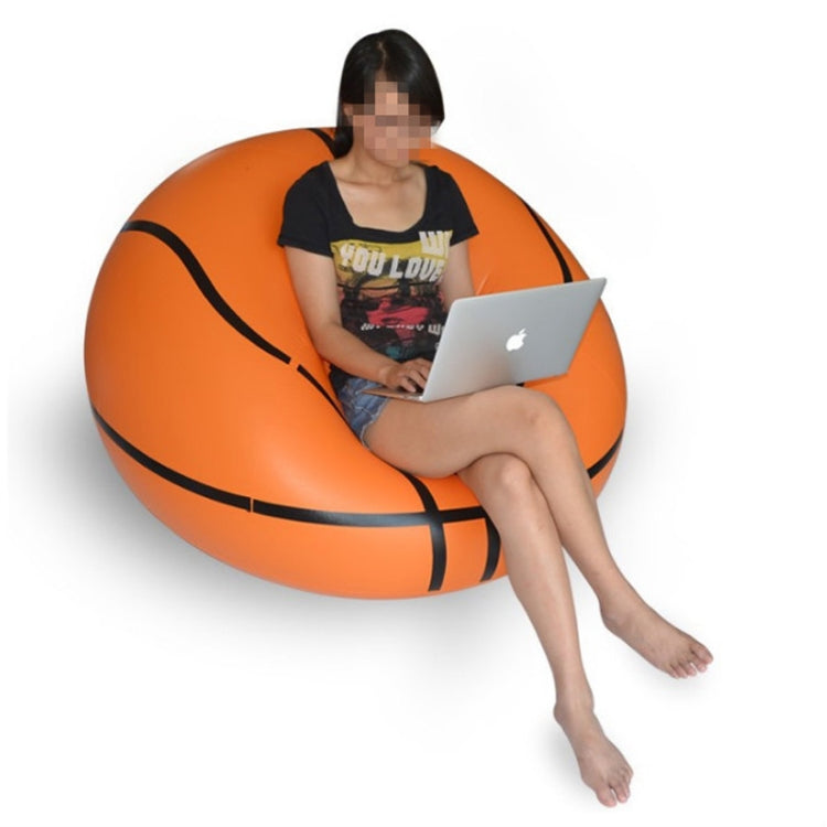 Orange inflatable single lounge chair with black trim and side seam lines