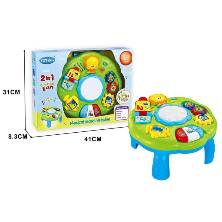 Green musical learning table toy shown with retail box and colorful activity keys