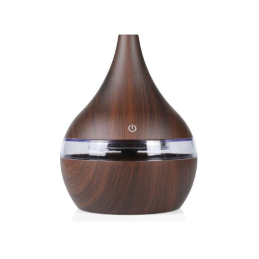 Dark wood-grain aroma diffuser with clear top ring and power button.