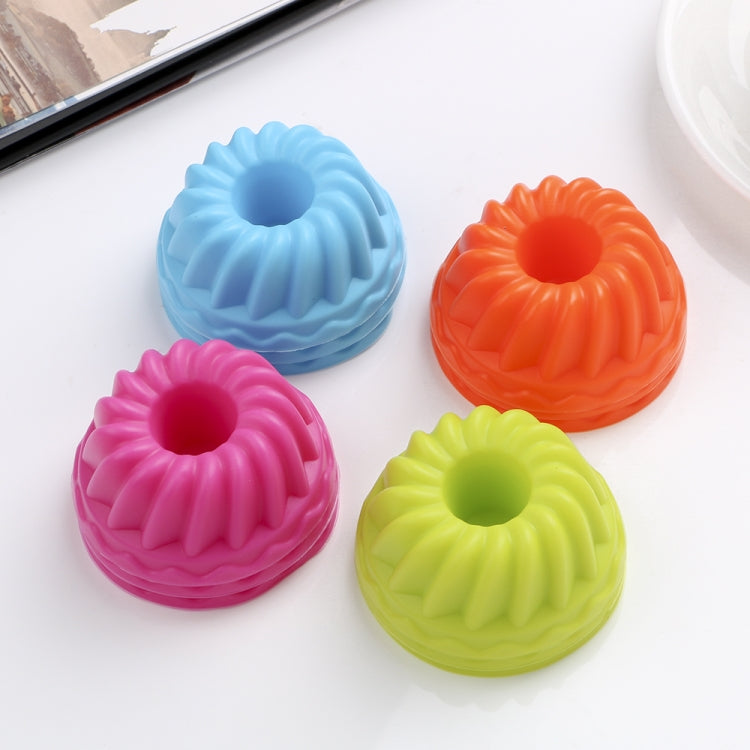 Set of four silicone thread-shaped baking mold cups in blue, pink, lime, orange