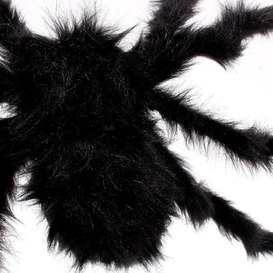 Close-up of black plush spider decoration with fuzzy legs and body