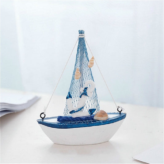 Canvas sailboat decoration, white hull with blue trim, blue net sail and lifebuoy detail