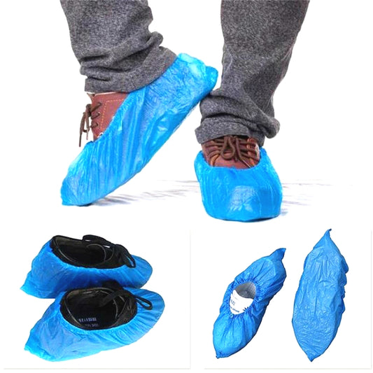 Set of blue disposable shoe covers with elastic cuff and open bottom
