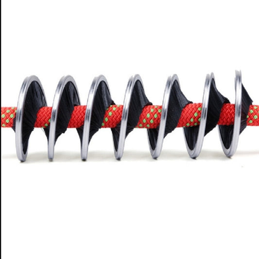 Climbing rope cleaning brush with bristles wrapped around a red rope segment