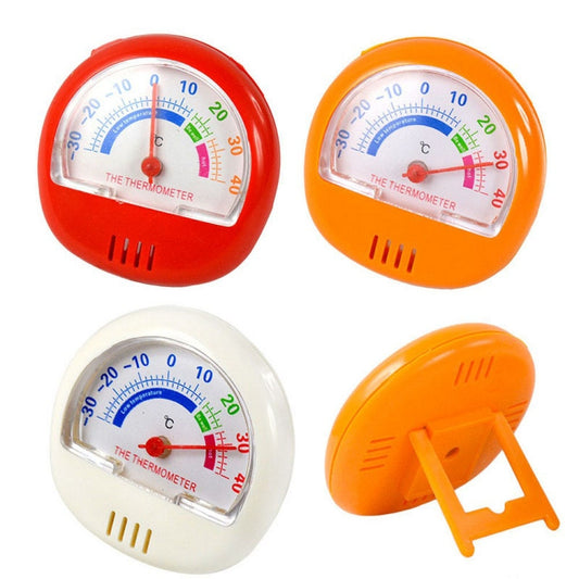 Set of analog freezer thermometers in red, orange, and white with Celsius dials