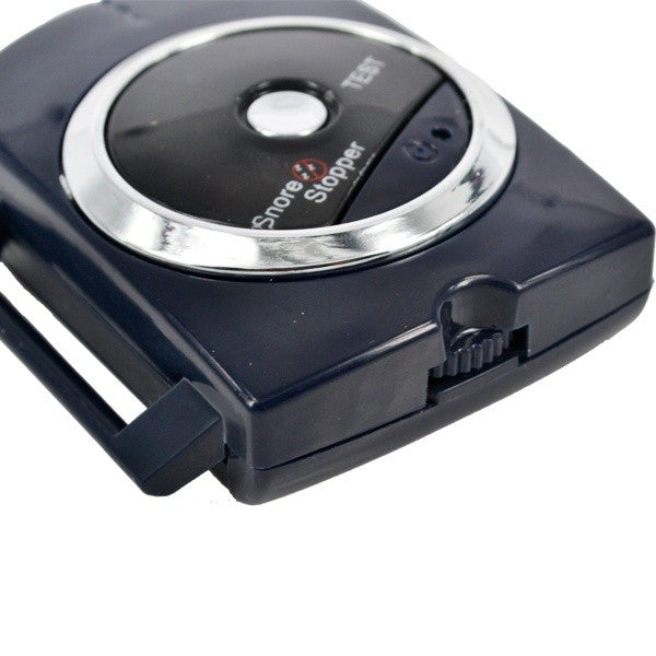 Close-up of round control panel on anti-snoring wrist device