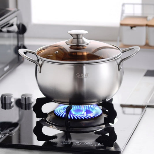 Stainless steel soup pot with domed lid and side handles, on gas burner