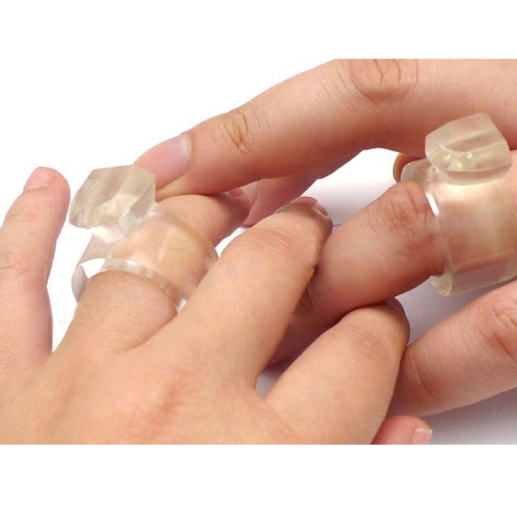 Hands holding ring-shaped ice cubes made in a silicone ice mold