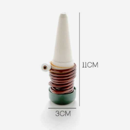 Automatic watering spike size view with white tip, dark base, brown coil
